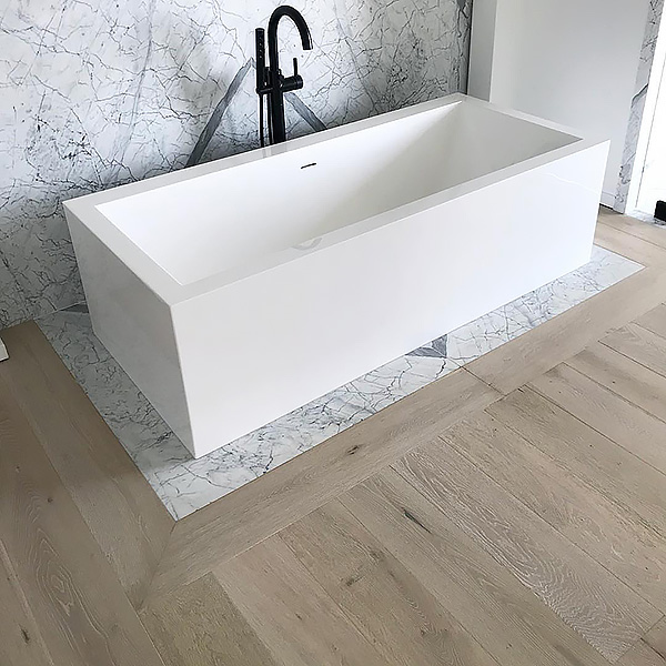 European white oak floors around a bath. 